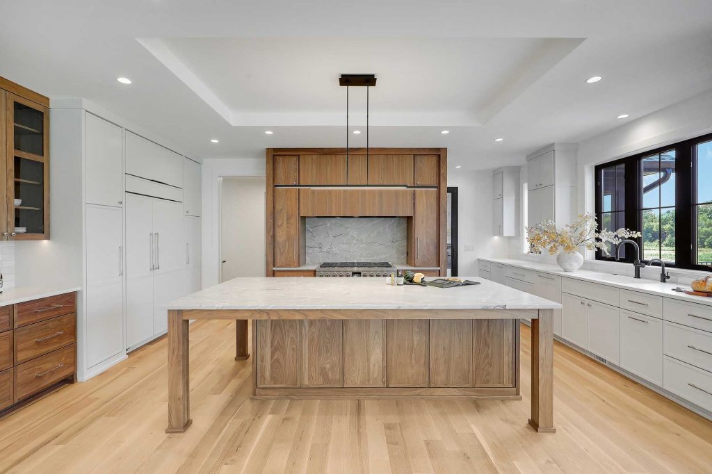 Built in shelf, big table and big windows in a kitchen/dining room. 3761 William Way Independence Mn 55359 26