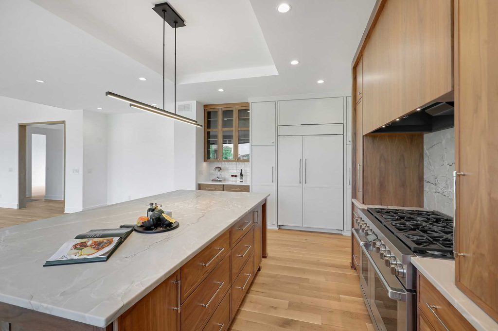 Kitchen view with an island and built in drawers on it. 3761 William Way Independence Mn 55359 35