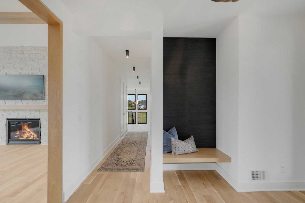 A hallway next to a built in bench with big windows at the end of the hallway. 3761 William Way Independence Mn 55359 62
