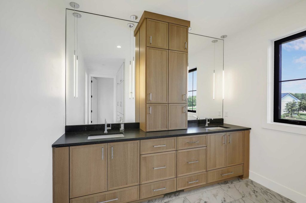 Bathroom with a double sink, built in cabinet and drawers. 3761 William Way Independence Mn 55359 76