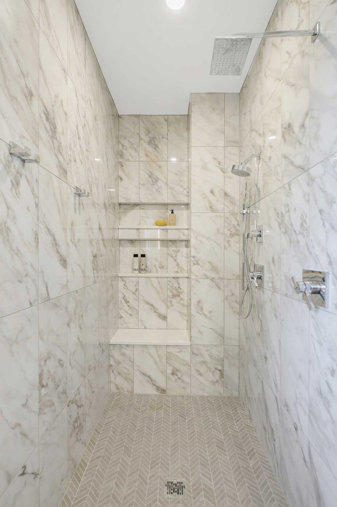 Shower stall with white and gold marble tile. 3761 William Way Independence Mn 55359 81